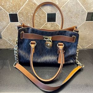 Brown and Caramel colored Michael Kors monogram bag.